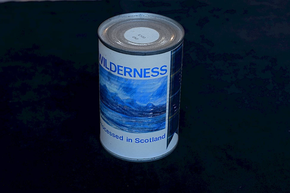 a can with a blue landscape. it reads: 'wilderness' at the top and 'processed in Scotland' at the bottom