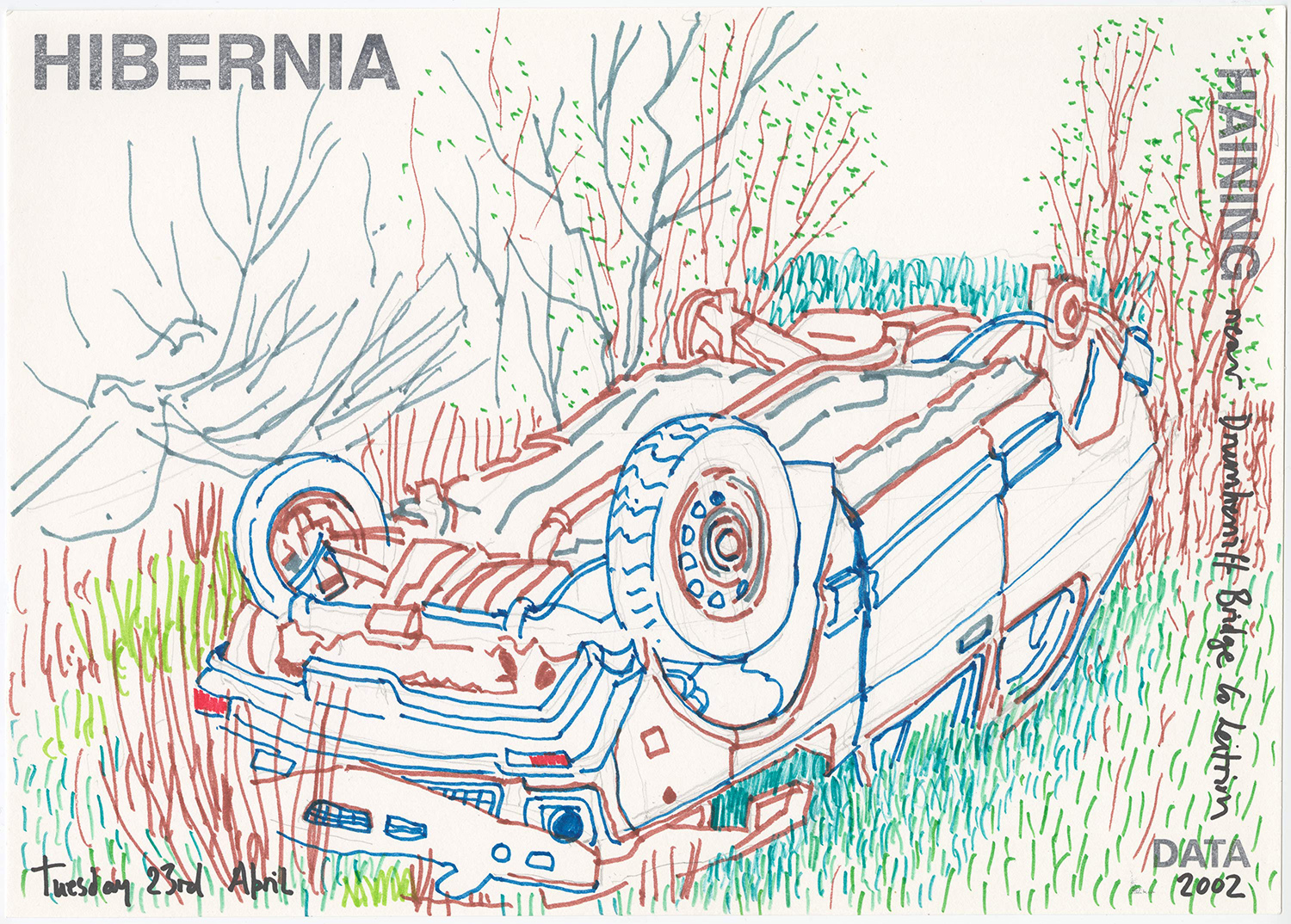 A colored pen drawing showing an upside-down car wreck in a grassy ditch, its undercarriage and wheels exposed. The scene is rendered in blue, brown, green, and teal lines suggesting tangled vegetation and bare spring branches. "HIBERNIA" is stamped at top left, "HAINING" runs vertically on the right edge, and text identifies the location as "near Drumherriff Bridge, Co. Leitrim." Dated "Tuesday 23rd April" with "DATA 2002" at bottom right.